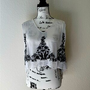 Free People  
Asymmetrical Black and White Sleeveless Crop Blouse